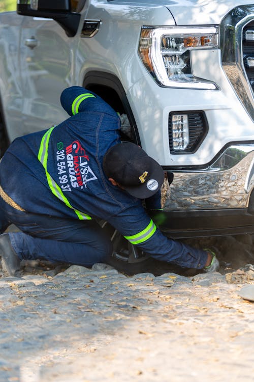 free-photo-of-man-fixing-a-car